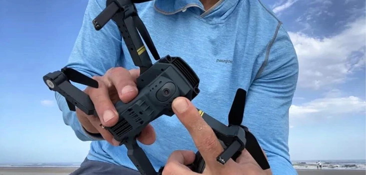 guy shows Black Falcon 4K Drone on camera